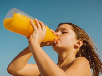 girl drinking orange juice