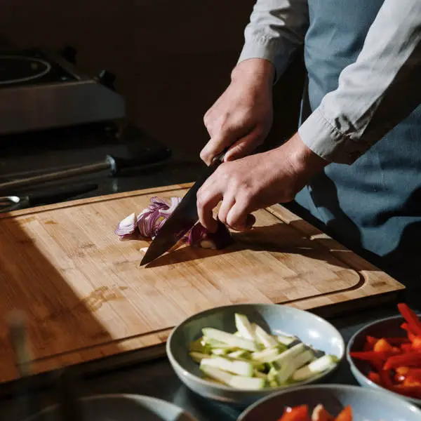 slicing vegetables with a kitchen knife