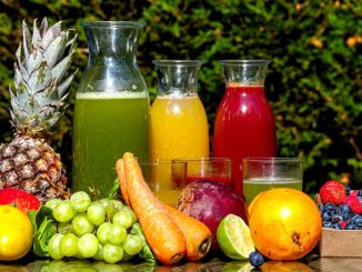 fruit, vegetables, and juice on table
