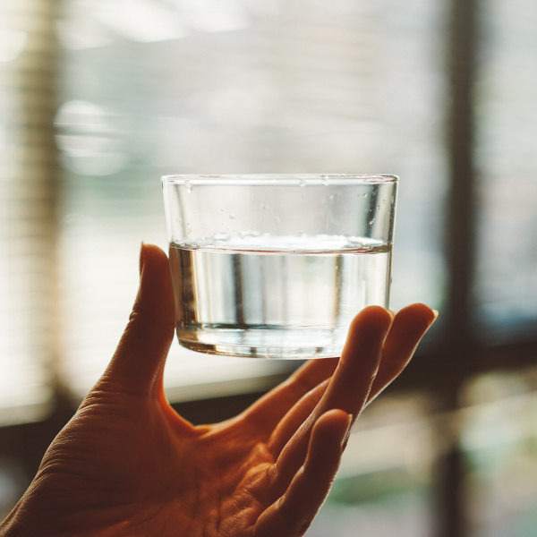 holding glass water