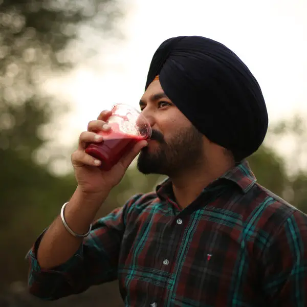 man drinking juice