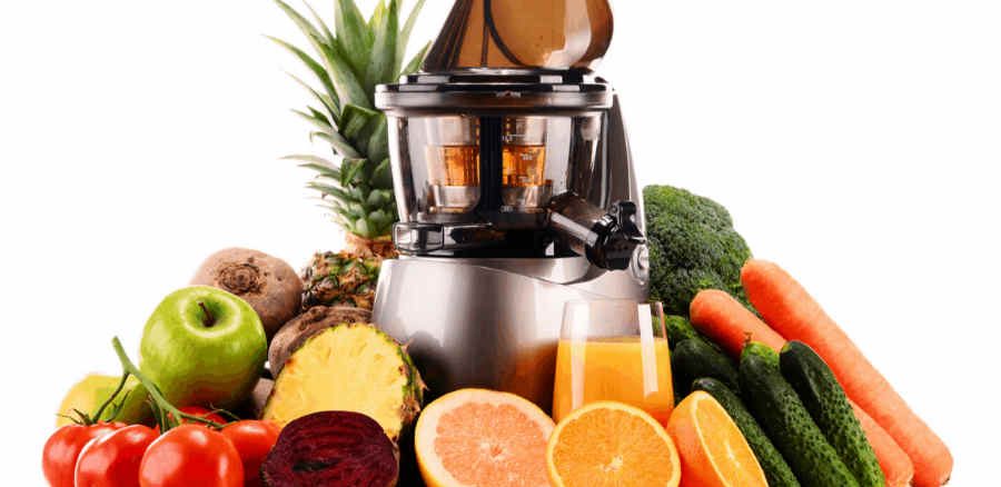 juicer surrounded by fruit