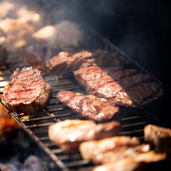 cooking meat on a grill