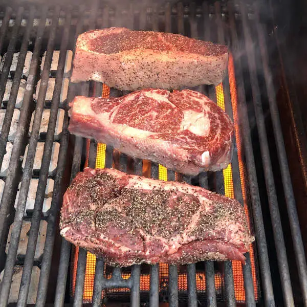 cooking ribeye steak on infrared grill