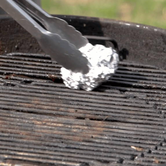 cleaning charcoal grill with foil