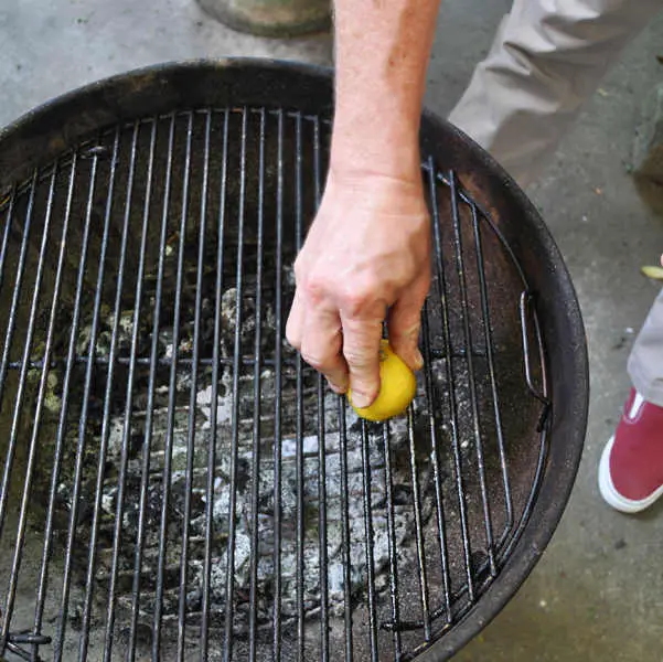 cleaning charcoal grill with lemon