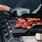 grilling sausages on gas grill