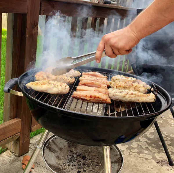 cooking chicken on charcoal grill