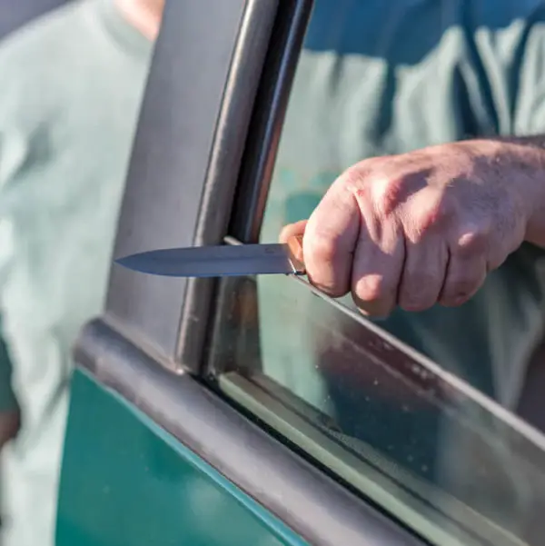 sharpening knife on car window