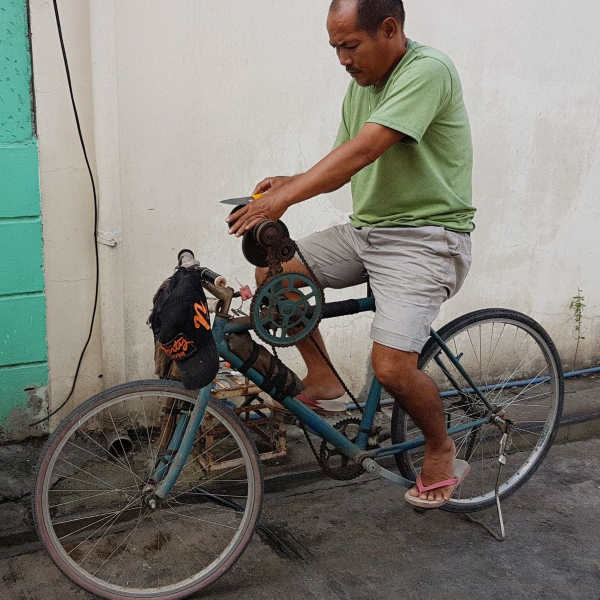 sharpening knife on bicycle