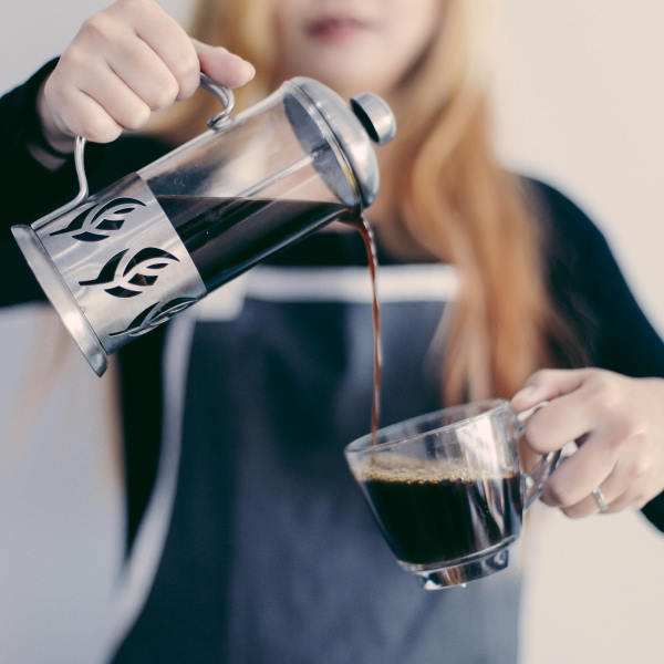 barista pouring coffee