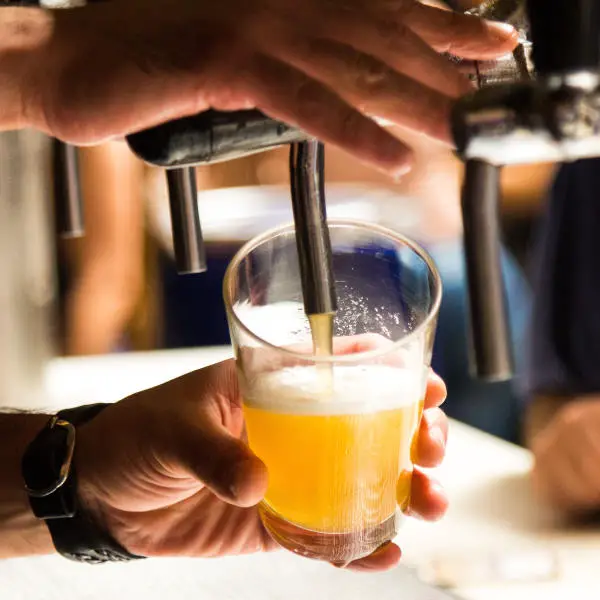 pouring beer into glass